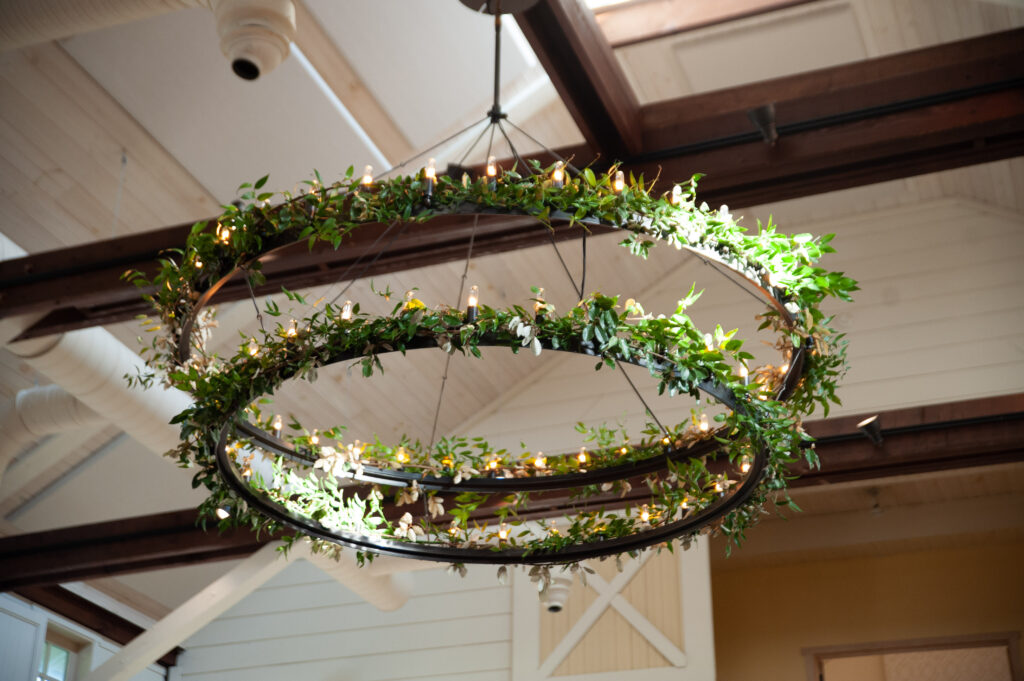 greenery on chandelier, wedding reception